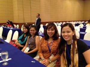 Teachers are all smiles while waiting for the convention to start